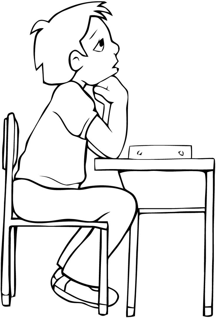 Мальчик сидит за столом