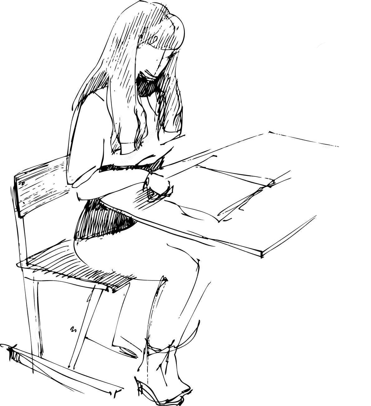 Человек рисует за столом