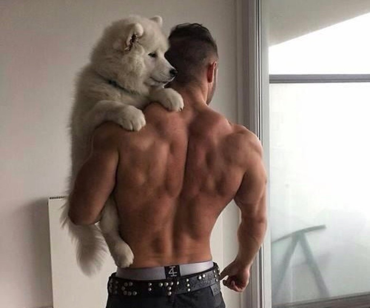 Парень с собакой со спины