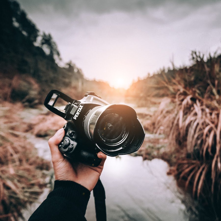 Фотограф с фотоаппаратом