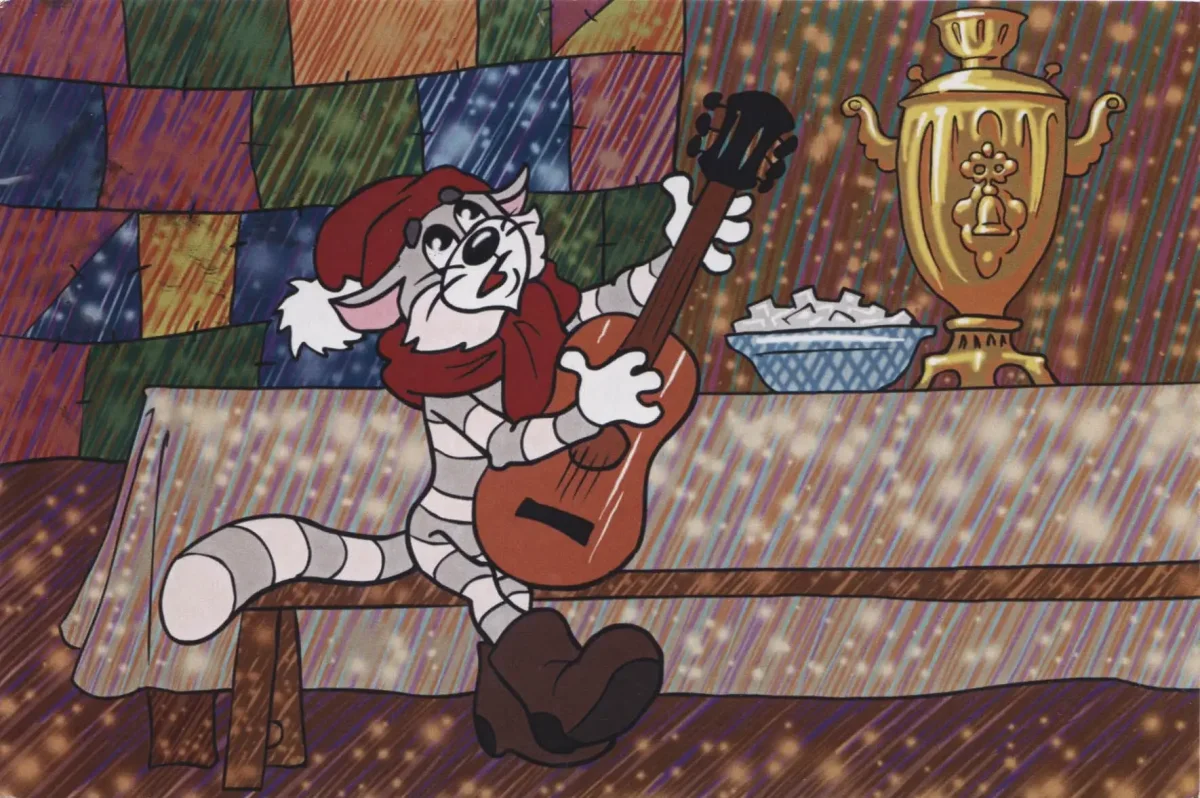 Кот в очках с гитарой